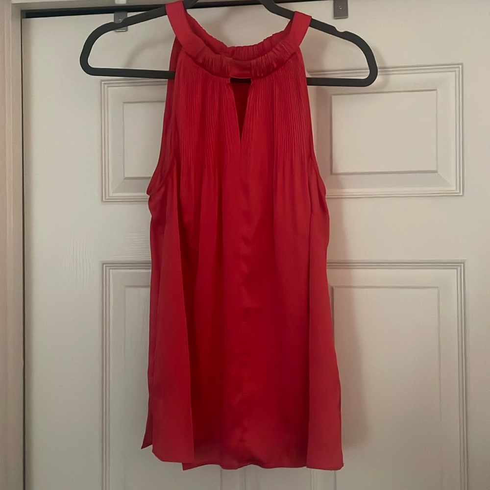 Never worn. 2 button behind the neck.